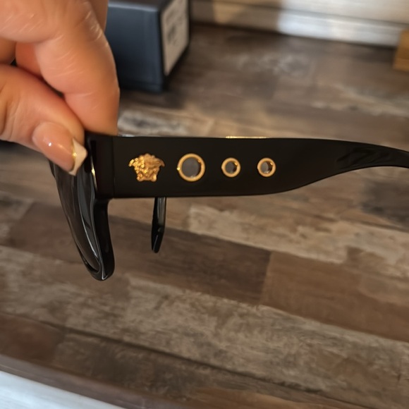 WNS Versace sunglasses worn once very good condition. black w/gold accessories.